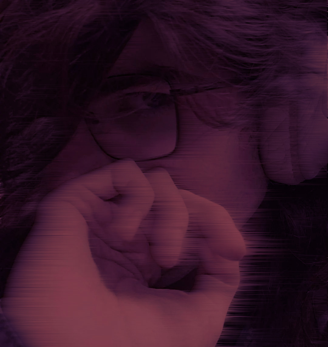 A selfie of me, hiding my mouth with my hand, with my glasses and headphones on. It's tinted in a maroon color, and has a wind effect applied to it.