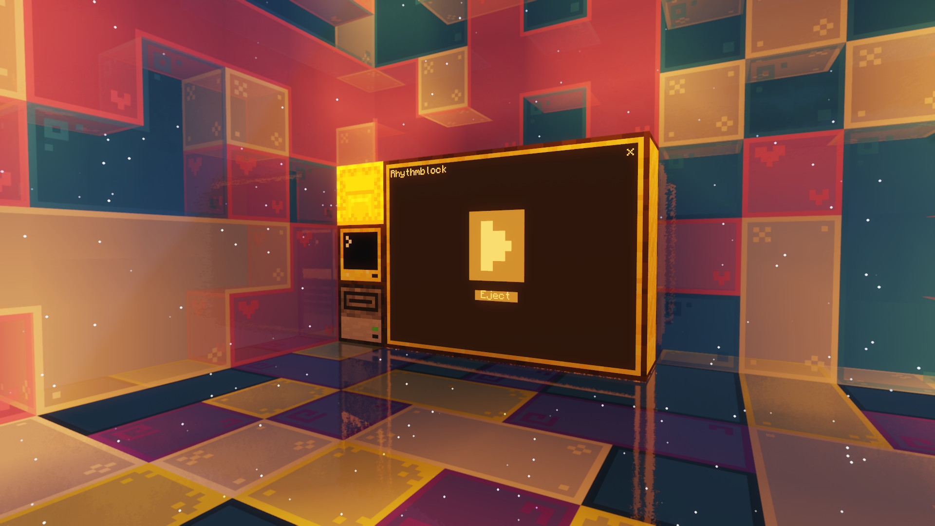 A screenshot of a Minecraft world. Depicts a glass cube with colors from both the non-binary flag and the transgender flag scattered accross tinted glass blocks. At the center of the image, a ComputerCraft computer with a monitor and disk drive attached to it. The monitor displays the interface for Rhythmblock.